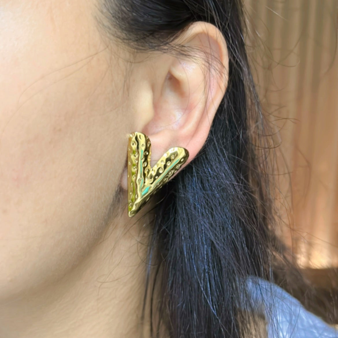 V-Shaped Gold Stud Earrings wearing