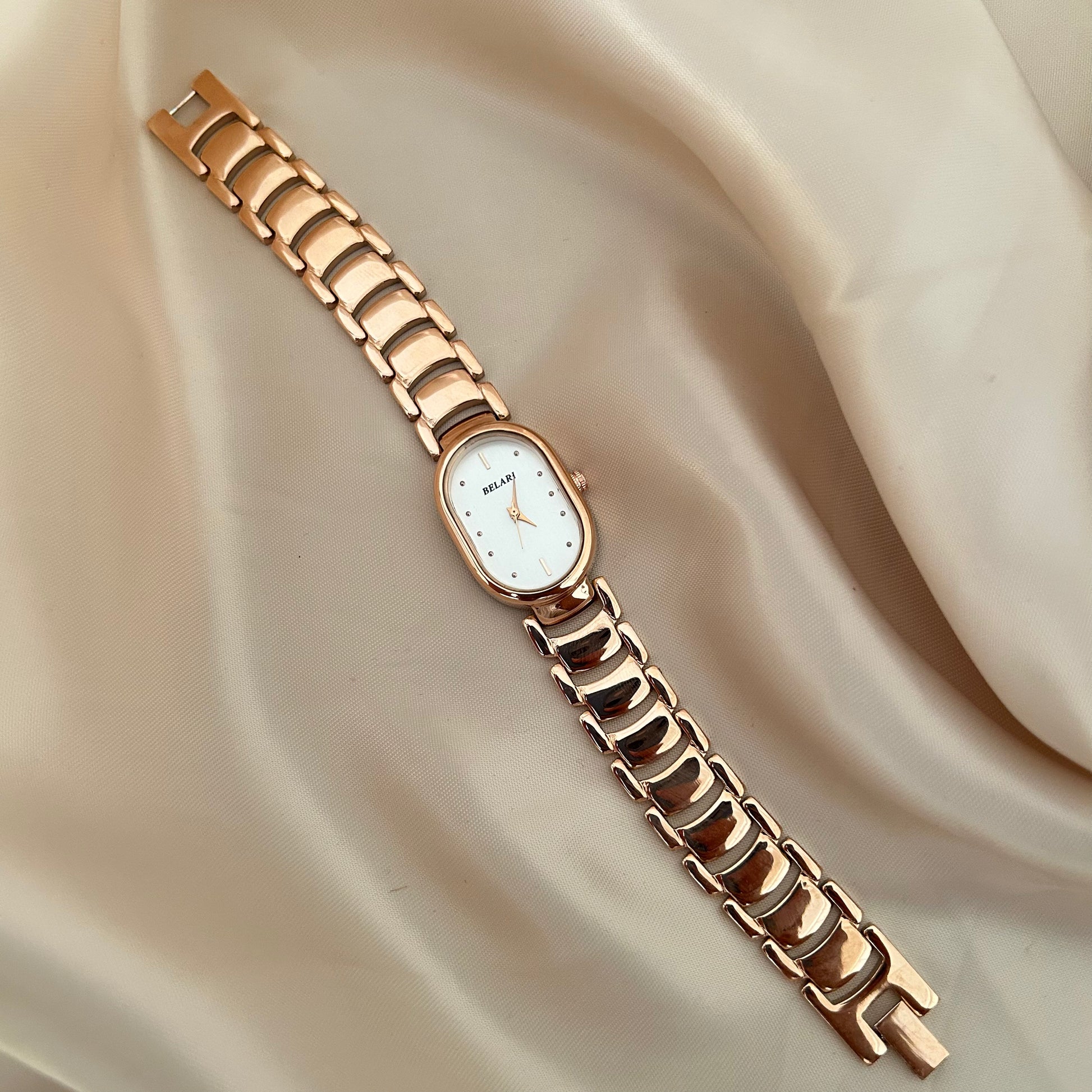 Slim rose gold watch with a delicate oval dial offering a feminine and graceful everyday style.