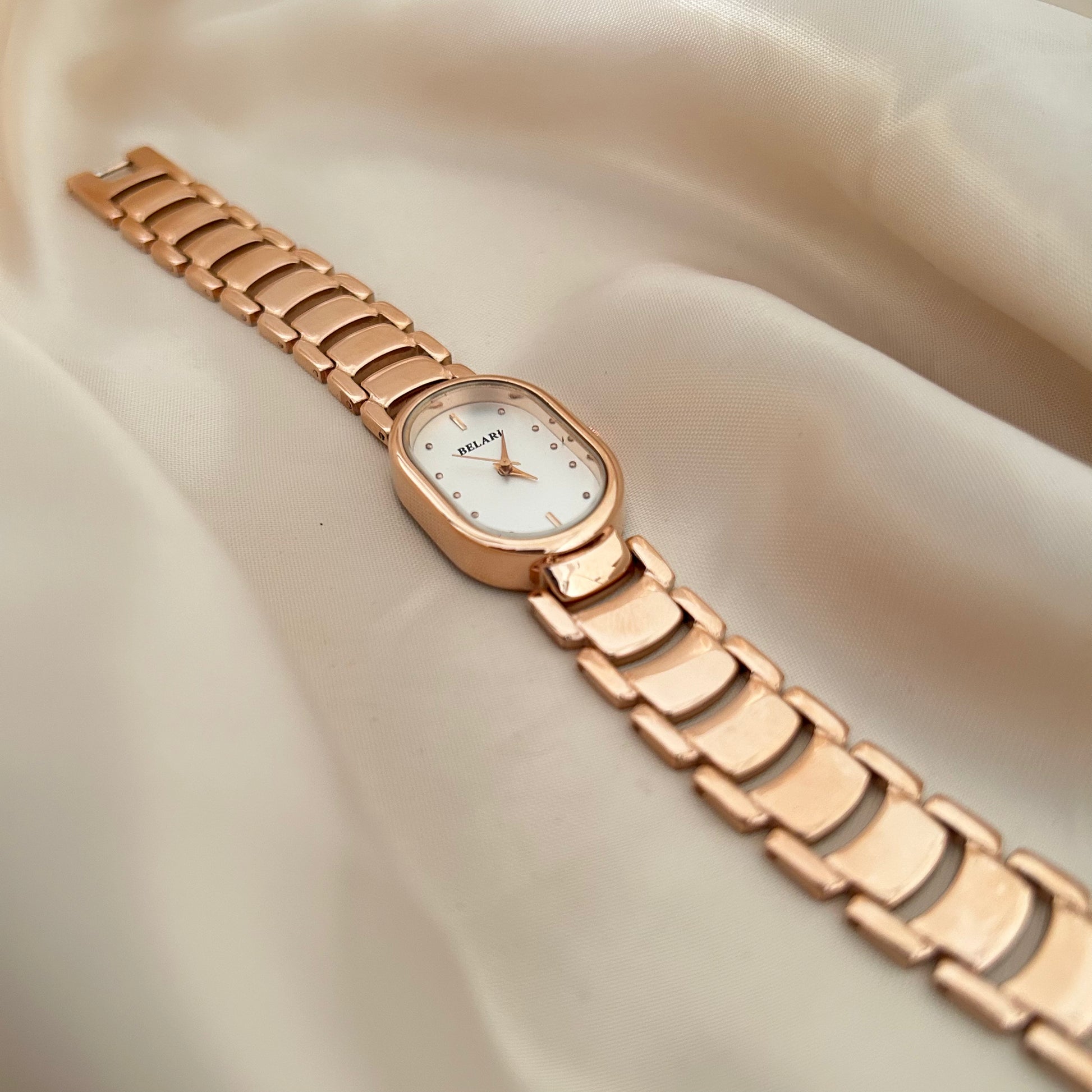 Slim rose gold watch with a delicate oval dial offering a feminine and graceful everyday style.