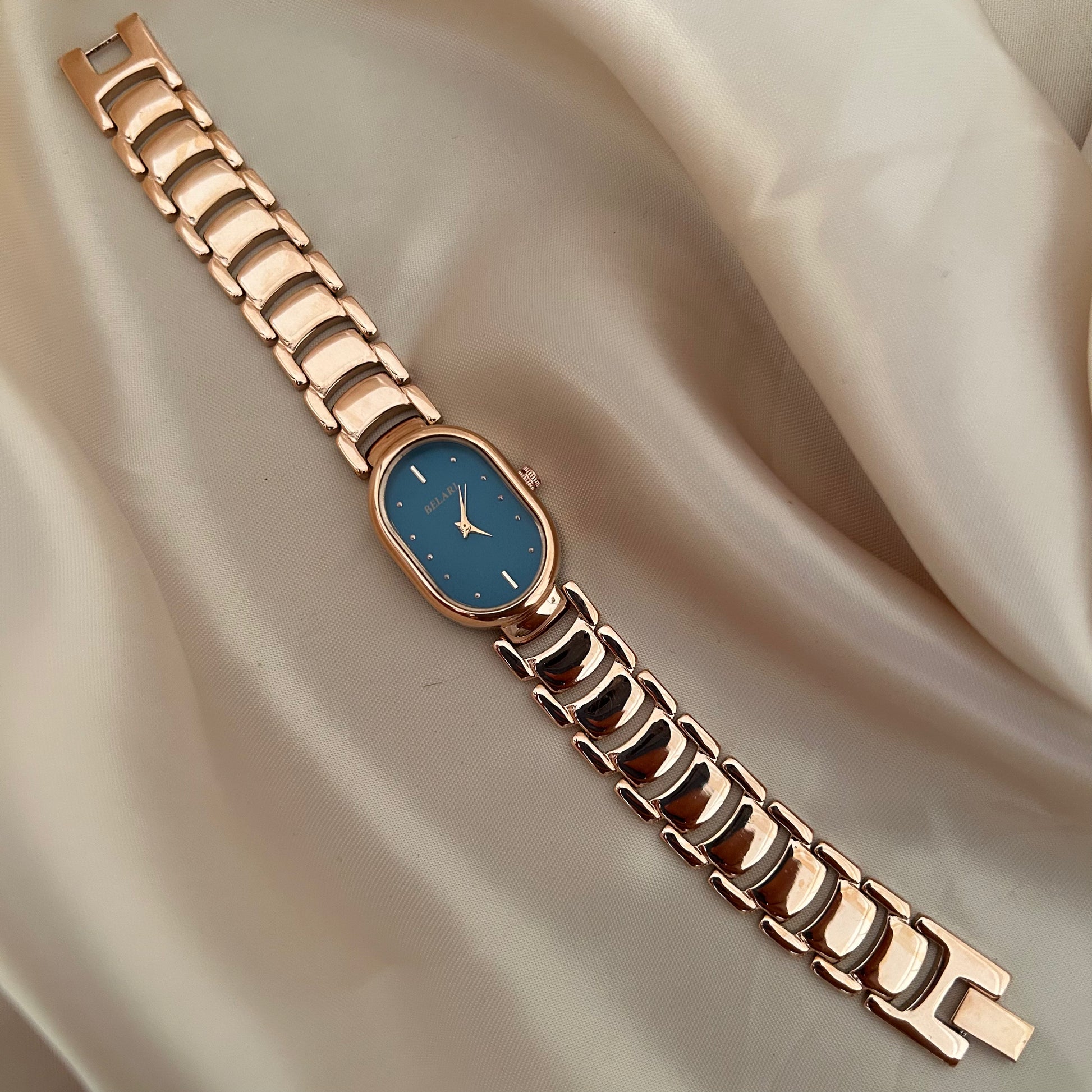 Slim rose gold watch with a delicate oval dial offering a feminine and graceful everyday style.