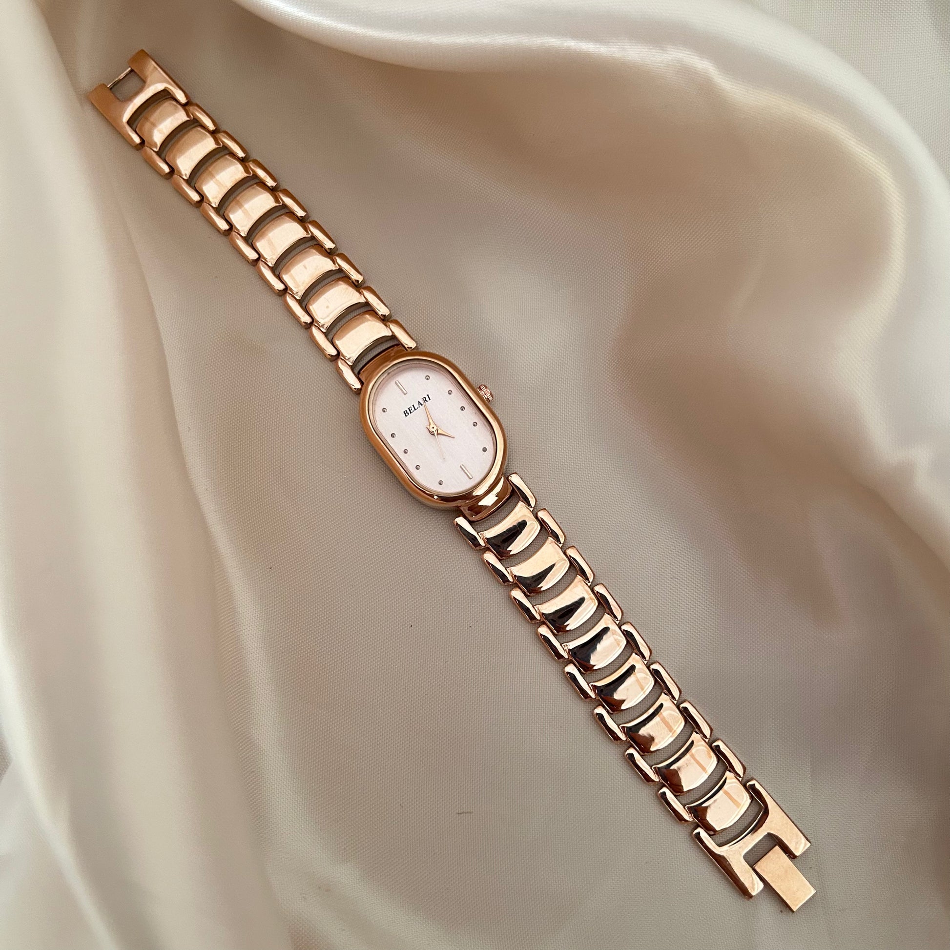 Slim rose gold watch with a delicate oval dial offering a feminine and graceful everyday style.