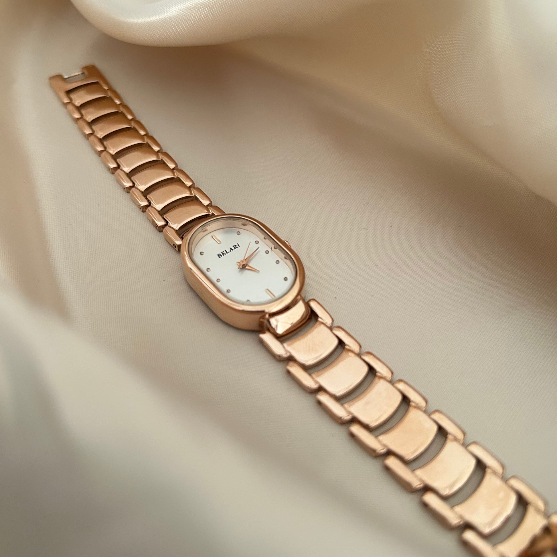 Slim rose gold watch with a delicate oval dial offering a feminine and graceful everyday style.