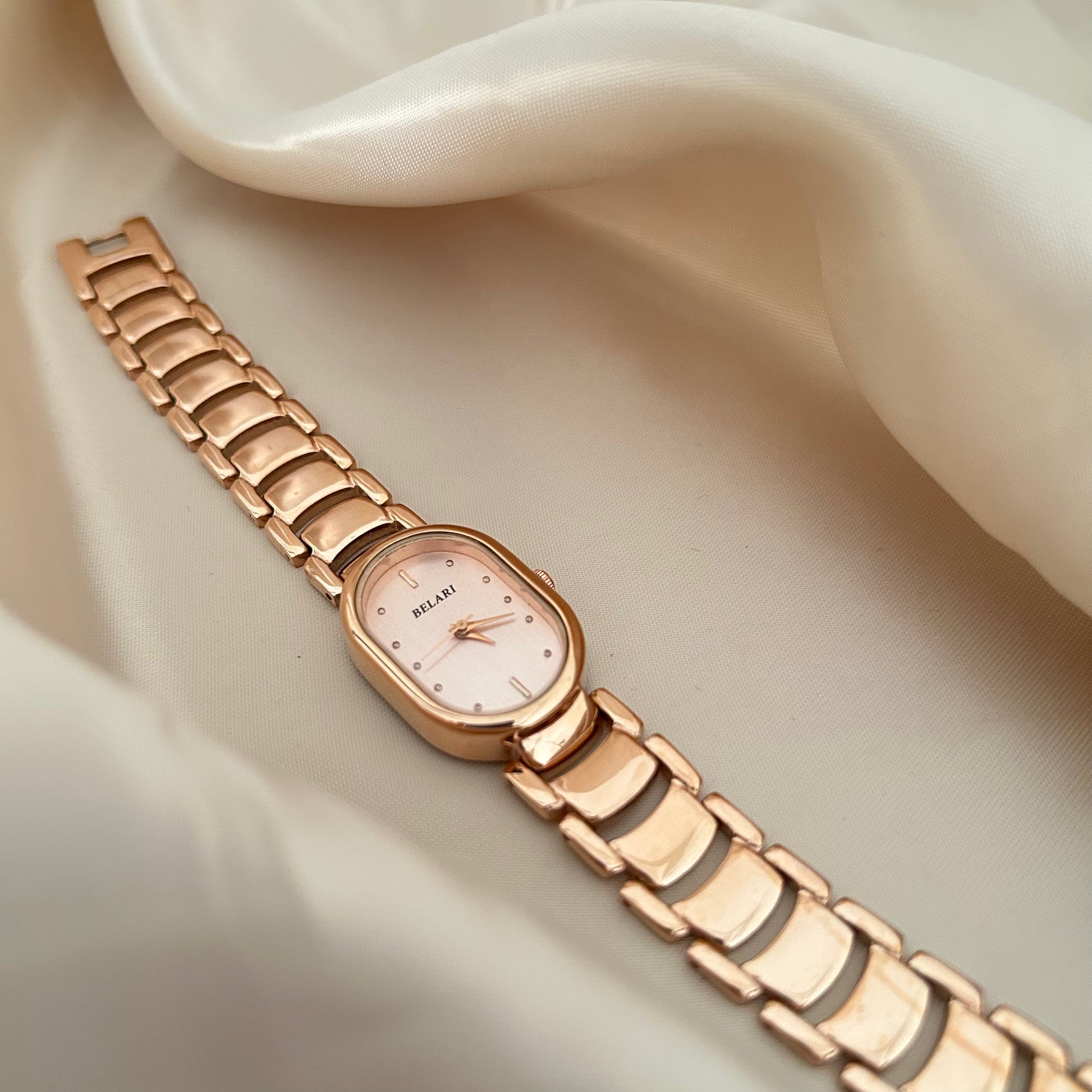 Slim rose gold watch with a delicate oval dial offering a feminine and graceful everyday style.
