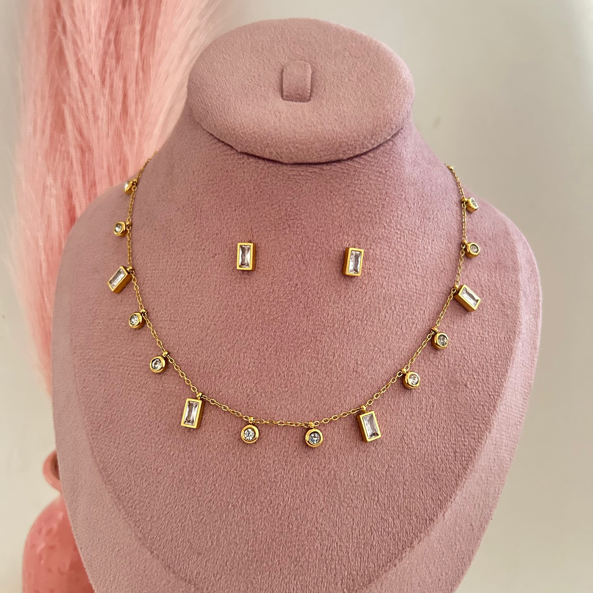 Gold necklace with rectangular charms and matching stud earrings