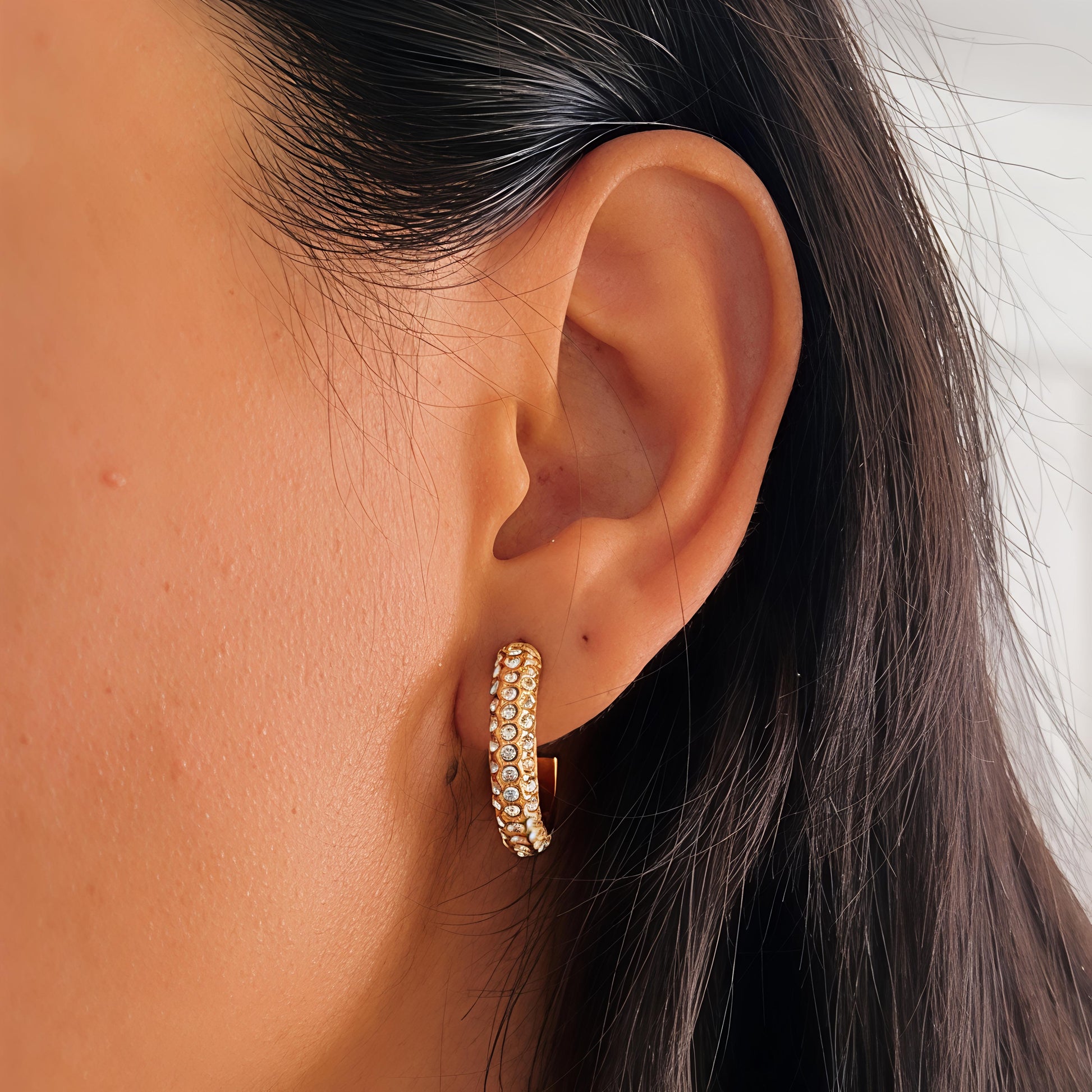 Gold hoop earrings with full stone studded pavé design